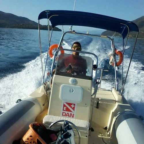 nautilus diving club skipper driving a speedboat